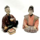 Pair of ceramic seated oriental nodding figures 18cm high - both have losses to the paint and male