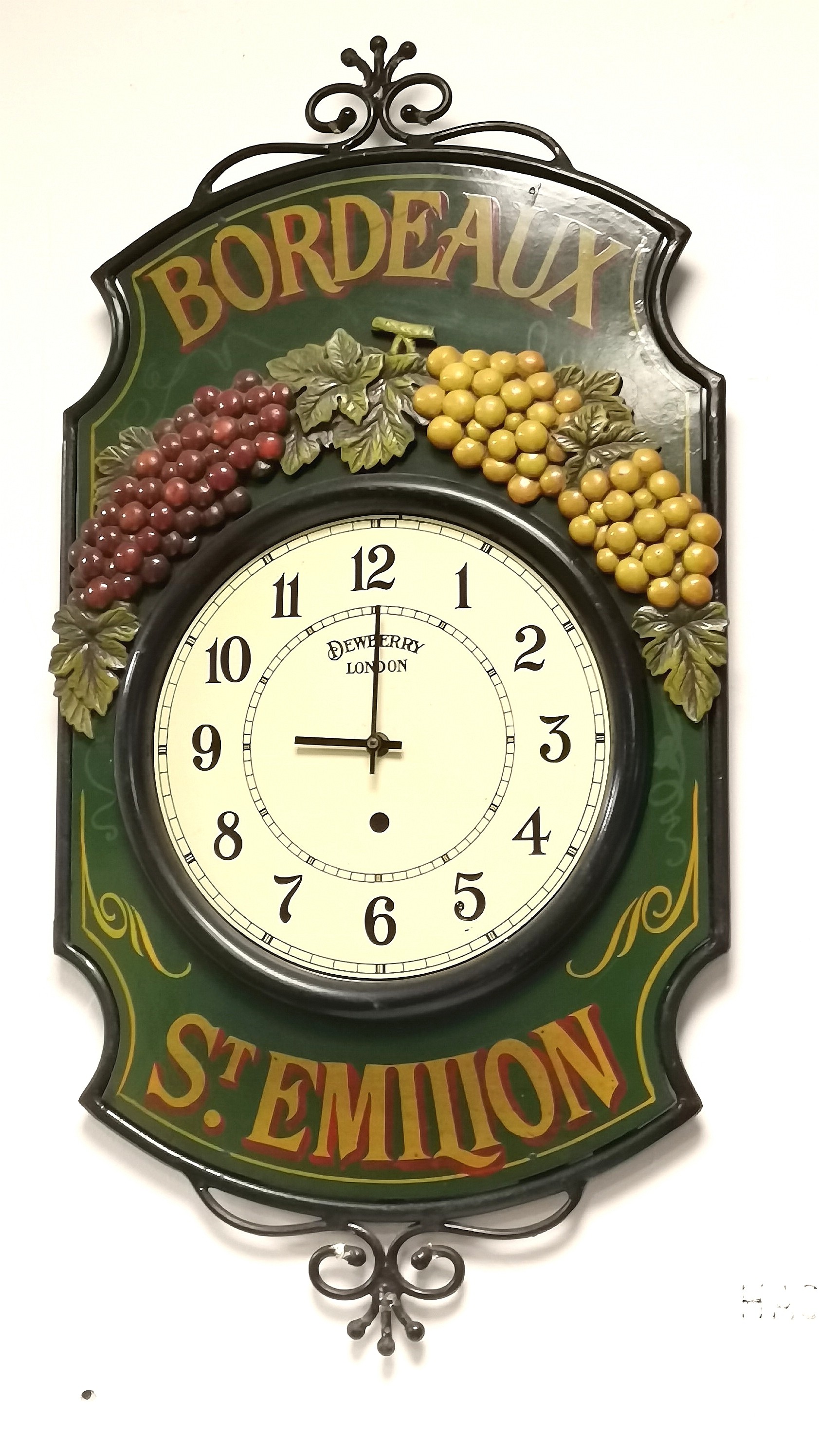 Unusual Dewberry (London) quartz wall clock with Bordeaux St Emilion decoration with an iron work