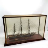 Glass cased of the Cutty Sark 72cm long x 20 deep x 48cm high Case is brass and the base is mahogany