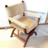 An occasional chair with X supports upholstered in a oatmeal coloured fabric, 82 cm in height, 60 cm