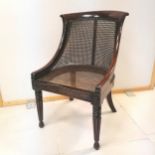 Antique Rosewood framed Bergère occasional chair, with pad seat. 82 cm in height, 50cm in width,