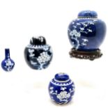 Chinese blue and white prunus ginger jar, cover complete with hardwood stand, 18 cm high, 16 cm