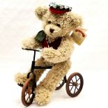 Biking teddy on a tricycle - 42cm tall