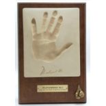 1990 Silk road gifts plaque of boxer Muhammad Ali's handprint + facsimile signature mounted on a