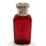 Antique unmarked silver topped ruby glass scent bottle with glass stopper 8cm high - has small dints