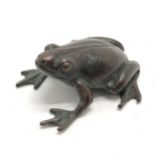 Antique oriental bronze frog figure with marks to belly - 4cm across