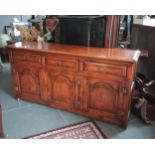 A Country style dresser base, fitted with three drawers & three cupboards, on square block legs, 172