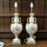 Pair of ceramic vase lamps, decorated with flowers on blush ivory background and gilded decoration