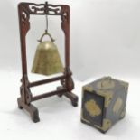 Oriental brass bell on stand 33cm high T/W a laquer and brass mounted cards box.