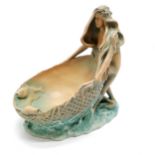 Ceramic table centre depicting a a maiden with flowing hair holding a shell and fish 25cm high x