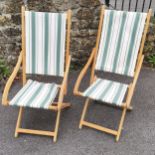 Pair of green and white striped deckchairs, in good used condition