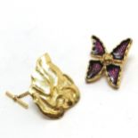 Yves St Laurent 2 x pin badges - flaming torch (4cm) & stylised flower with purple detail