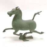 Cast metal figure of a horse with green patinated finish 17cm high x 21cm long