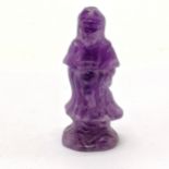 Carved amethyst figure of an Oriental deity - 6.5cm