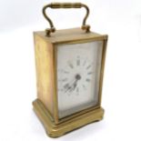 Brass cased carriage clock with ceramic dial 15cm high - missing it's back and crack to dial