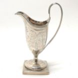 Georgian silver cream jug on a square base with engraved decoration - 14cm high & 114g - marks