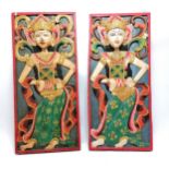 Pair of carved and painted Balinese wooden plaques of dancers 29cm x 66cm - some losses