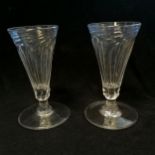 Pair of wrythen twist antique drinking glasses with wide foot rims 8cm diameter to foot x 14cm high-
