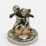Small sterling silver miniature of 2 cherubs wrestling - 1.2cm high & 3.5g