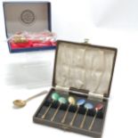 2 boxed sets of spoons both with enamel detail 1 red spoon has damage