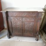 Antique carved oak 2 door cabinet with carved floral decoration to the panels 98cm wide x 40cm