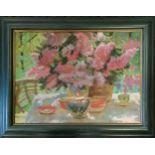 Framed oil on canvas painting of a table with teaset and vase of flowers with signature lower