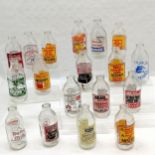 18 x vintage advertising milk bottles inc Cadburys drinking chocholate, Crusha milkshake, St Ivel