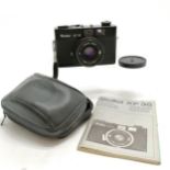 Rollei XF 35 camera has a Sonnar 2,3/40 lens in original case with booklet- shutter is working