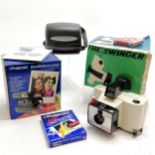 2 Polaroid boxed cameras- The Swinger model 20 and CoolCam 600 and a packet of unopened film