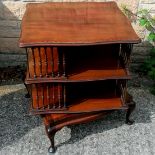 Good quality revolving mahogany and inlaid, 2 tier bookcase, being of serpentine shape, turned