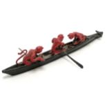 Unusual painted lead model of 3 red devils rowing a boat - 15cm long- 1 devil is missing it's tail