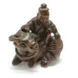 Carved wooden netsuke of a man and a water buffalo 4.5cm high