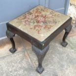 Antique footstool with carved ball and claw detail to the feet and a tapestry covered top- 57cm x