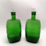 Pair of antique green ribbed decorated green flasks / bottles with original clear glass stoppers -