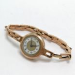 9ct marked rose gold Audax ladies wristwatch on sprung 9ct gold bracelet (1 link stretched &
