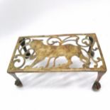 Unusual antique brass trivet with tiger detail on ball & claw feet - 25cm x 14cm x 10cm high