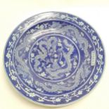 Oriental blue grounded charger with dragon detail and bears script - 40cm diameter with no obvious