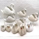 Collection of Dartmouth pottery swans of varying sizes, Largest 29 cm high, 34 cm length (crack to
