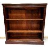 Antique mahogany bookcase, Fitted with 2 adjustable shelves, on platform base. 98 cm wide, 100 cm