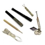 Dunhill cheroot holder (9.5cm), silver cased glove hook with coin love tokens and Galations V enamel