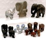 Collection of assorted elephants, to include a stylised carved stone mother and baby 16 cm high,