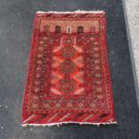 Red rug in good condition. Measures 105 x 77cm.