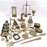 Collection of assorted brassware to include horse brasses, small scales and weights, hour glass 16