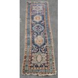 Karaja Persian runner rug in blue and black. Measuring 250 x 75cm. Slight crease in the middle