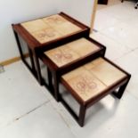 Mid Century Teak Nest of 3 tables with tiled tops decorated with horse chestnuts, largest 55 cm