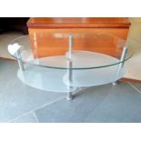 Contemporary glass tv stand, with frosted glass shelves with chrome supports.