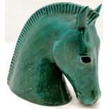 An Italian Terracotta stylised horses head, slight chip to ear and base 25 cm high, 27 cm wide.