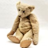 Antique German mohair bear, play worn condition, loss of stuffing, worn pads, slight hole to leg, 60