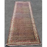 Seraband Persian runner rug c.1920 in orange and black. Measures 228 x 118cm. In good used