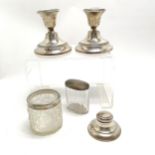 Silver pair of 1918 candlesticks (10cm high with loaded bases) - both with dents and glue repairs